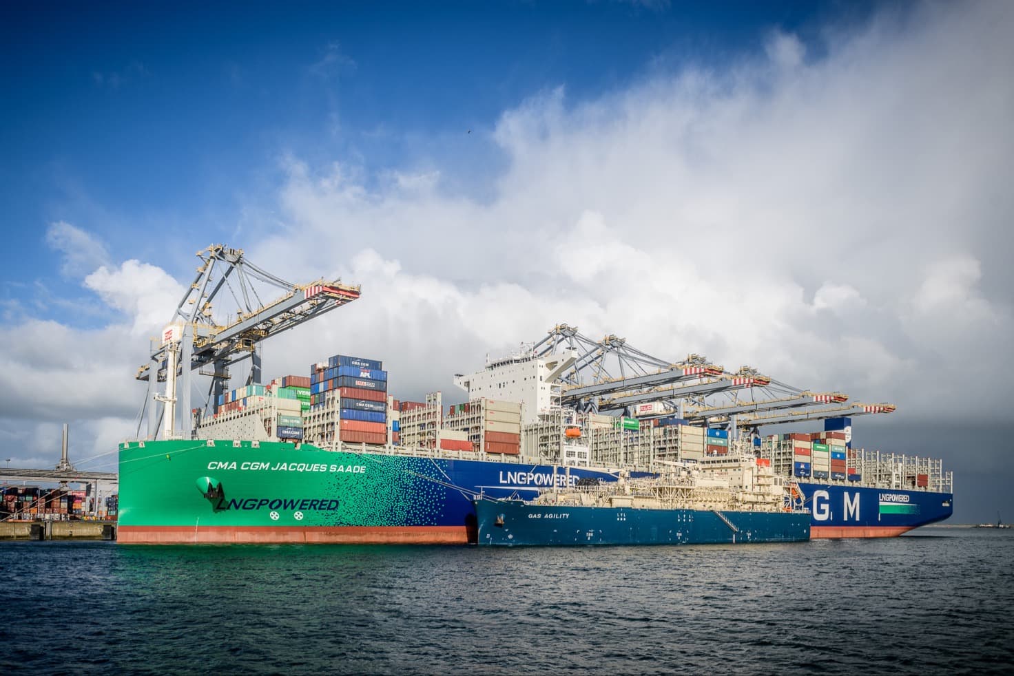 Bunkering support vessel operating alongside a ship at sea.